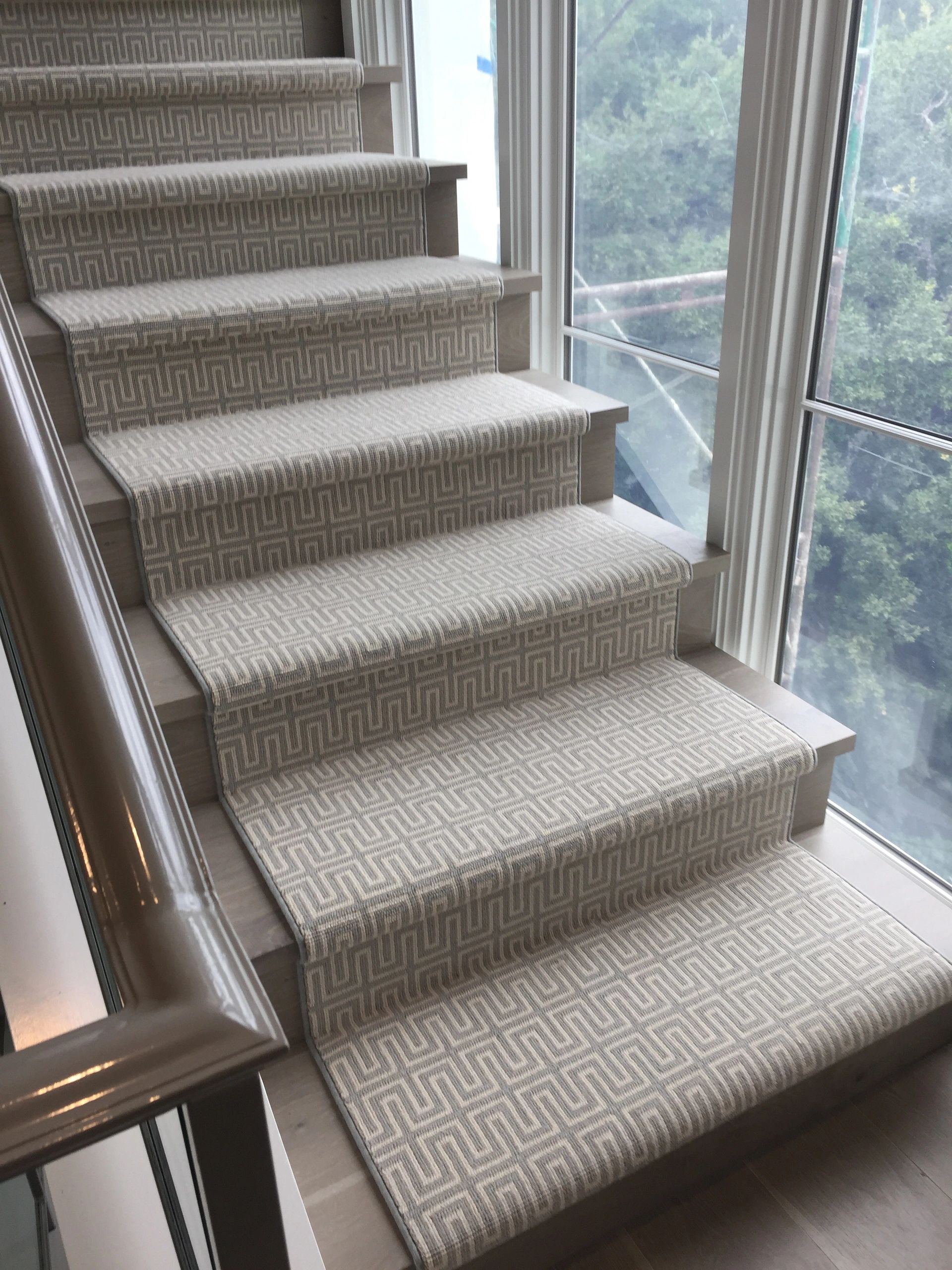 Patterned carpet stair runner in an Austin home, supplied by Benson Carpet and Floors